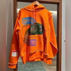 Advisory Board Crystal x GUESS Orange Planet Saving Hoodie.
